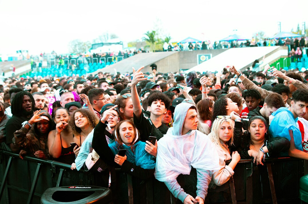Wide shot of an event audience in a conference hall